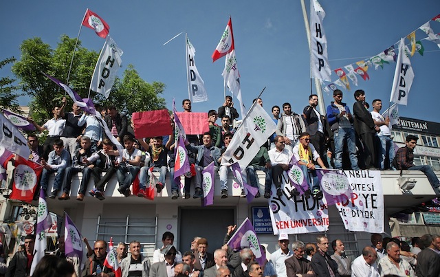 epa04745145 Supporters of the Turkish Peoples' Democratic Party (HDP), cheer during an election campaign in Istanbul, Turkey, 12 May 2015. Turkey's general elections will be held on 07 June 2015. A public opinion poll released at the end of April 2015 showed that the ruling Justice and Development Party (AKP) in Turkey would receive just 38.1 per cent of the vote in the upcoming elections, down from the 49.8 per cent the party received in 2011. The poll also showed the newly formed pro-Kurdish Democratic Peoples' Party (HDP) passing the 10 per cent electoral threshold.  EPA/ULAS YUNUS TOSUN