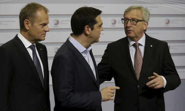European Council President Donald Tusk (L) looks on as Greece's Prime Minister Alexis Tsipras (C) speaks to European Commission President Jean-Claude Juncker before the Eastern Partnership Summit session in Riga, Latvia, May 22, 2015. REUTERS/Ints Kalnins