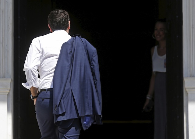Greek PM Tsipras arrives at his office in Maximos Mansion in Athens
