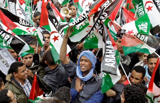 Protesters waving Western Sahara flags shout slogans during a protest against the Moroccan government, in Madrid, Saturday, Nov. 13, 2010.